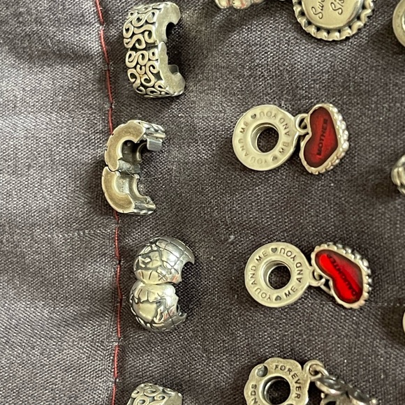 Lot of 26 Authentic Pandora charms.